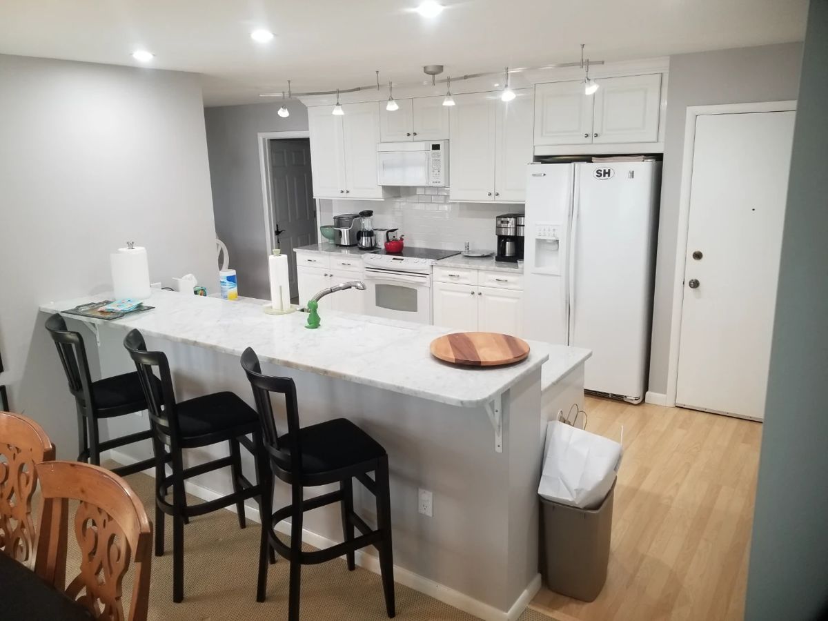 3 black bar stools; trash can