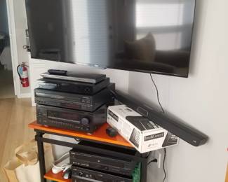 Roku TV. Stero equipment. Polk sound bar; Niles equipment