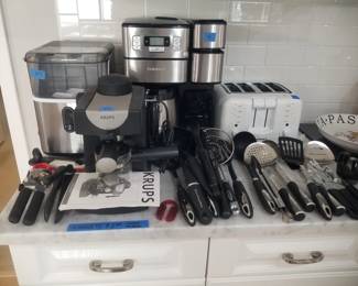 Countertop ice maker; Krups espresso maker; Cuisinart coffee maker; Cuininart toaster