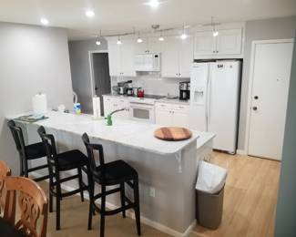 3 black bar stools; trash can