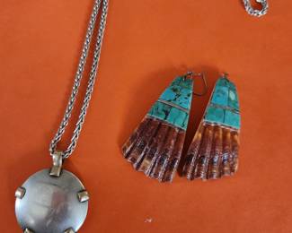 Silver Necklace with Silver Pendant. Unusual Shell Earrings with Turquoise Inlay. Both are very good and unique. 