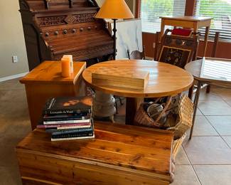 Handcrafted solid wood chest, coffee table art books, chess set, handcrafted solid wood table, antique Quincy organ, antique restored Eastlake style Victorian chair, baskets