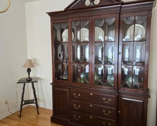 Ethan Allen China cabinet.  Inside there is green depression glass and China set