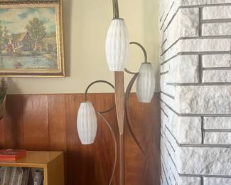 1960’s pool lamp, with three milk, glass shades with no chips or damage, teak, surfboard wood accents, and brass swirls. Excellent vintage representation of the pole lamps from that era.