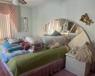 1980’s “ shell” and mirror formica Queen BR set; set includes headboard, shown, bedframe, matching end, tables, dresser, with mirror, and petite armoire. Bedroom Set is available for pre-sale.