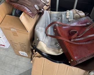 Boxes full of designer handbags