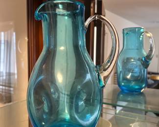 Vintage hand-blown art glass pitcher in a turquoise color. 
