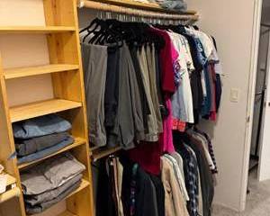 Lot 371  Assorted Mens  Womans Clothing Lot Including Jeans, Shirts, Pants, and Jackets