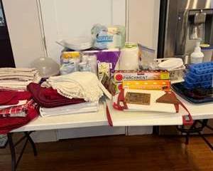 Lot 52  Assorted Kitchen and Dining Lot with Textiles and Disposable Supplies