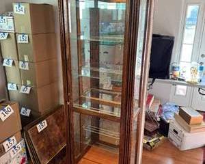 Lot 202  Howard Miller Curio Cabinet