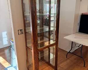 Lot 203  Howard Miller Wooden Curio Display Cabinet