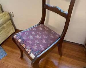 Lot 291  Vintage Wooden Chair with Floral Carving and Worn Upholstered Seat