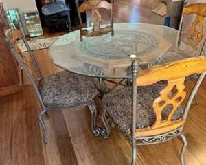 Lot 206  Ashley Furniture Heavy Wrought Iron Dining Set with Glass Table and WoodBacked Chairs