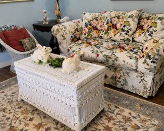 Wicker trunk, floral loveseat