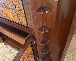 Mid-Century George Zee Asian hand-carved Chinoiserie dry bar cabinet with a flip top, side shelves and corner wine glass holders. 36" wide x 18"deep x 40" high.