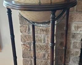 Vintage Cram's World Globe on a wooden floor stand.