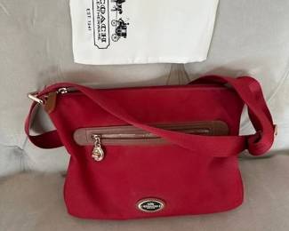 Coach Sawyer crossbody bag in classic red polyester twill with brown leather trim.
