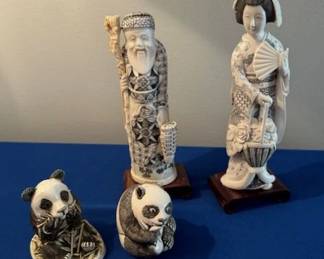 Japanese faux ivory okimono figures and "Bamboozled" panda trinket box.