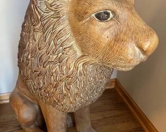 Carved and painted composition lion marked DR/79 (JS), 32" tall.