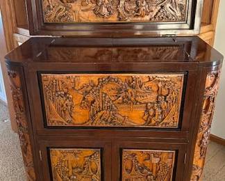 Mid-Century George Zee Asian hand-carved Chinoiserie dry bar cabinet with a flip top, side shelves and corner wine glass holders. 36" wide x 18"deep x 40" high.