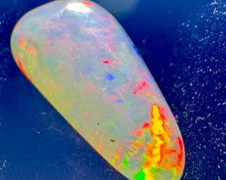 Fire display opal cabochon, 5+ carat 