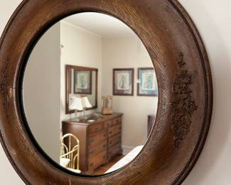 Oak round wood wall mirror with ornate carved details, nice patina!