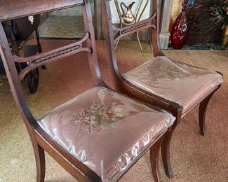 5 Duncan Phyfe style original upholstered embroidered mahogany dining chairs. Plastic protection can be removed. 36inches high,16 1/4 across and seat is 171/2 high 18 iced across. One chair with arms also available.