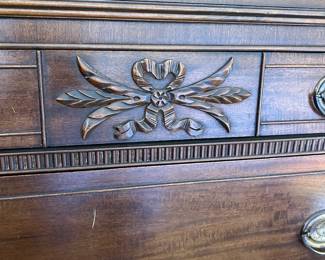 One handle pull is missing, can easily be replaced. In excellent condition all draws work well. Carved detail