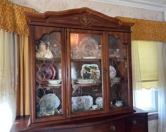 Basset China Cabinet 54x52 1/2 x 13 inches , 2 glass shelves, 4 separate removable pieces. Middle opens, no lock, thin gold metal decorative inlay on side glass, can be removed if desired. Working light inside, groves for dishes inside.Nice, well cared for piece.