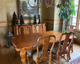 Dining table, buffet, large paintings