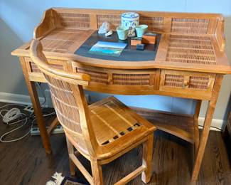 $360.  Colonial style bamboo rattan and wood desk with chair. Chair has an as found issue.    Desk is 43 inches wide by 20 inches deep by 36 inches high.