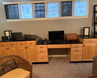 Extensive functional workstation. Separates into three pieces for easy moving or reconfiguring as you need for your home office use.   Total length is 127" x 25"d x varying heights. Each end section is 35"h the desk section is 25".  Lots of bells and whistles.