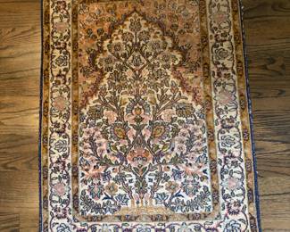 $260.  Silk prayer rug from Kashmir, India.  2' x 3'.  Appraised value in 1986  at $700