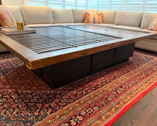 Side view showing the base which also has a door on each side to storage.