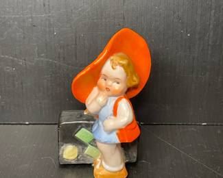 Vintage Ceramic Girl Figurine with Orange Hat and Suitcase