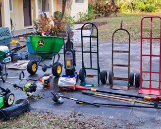 Outdoor items including Lg Dog Kennel, Spreaders - push or tow, Air compressor, Dollys, Vacuums, Water Skis, Umbrella stands, Weedwackers Echo and Ryobi