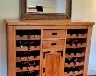 Wine Display and Cabinet, gorgeous wood finish, each tray holding 3 bottles slides out to exchange wine. 2 drawers and door with shelves storage for wine related items
