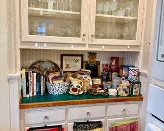 vintage kitchen aprons, cookbooks, lots of stemware.