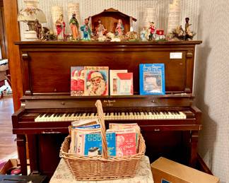 Antique upright piano with vintage Christmas nativity.