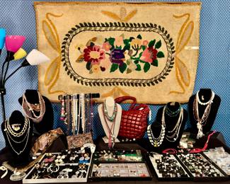 More costume jewelry with hooked rug.