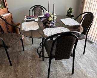 Glass kitchen table with chairs.