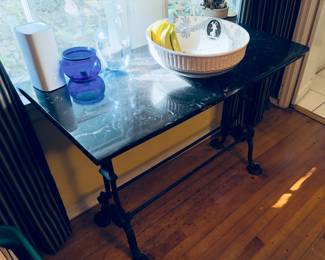 Side table. Marble top with iron legs.