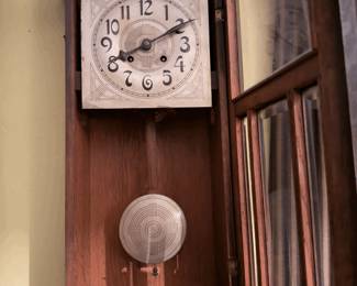 Classic antique wooden wall clock with pendulum. Keys included. 