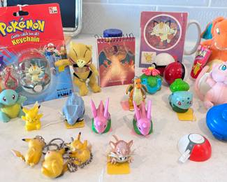 Sealed package Pokemon Keychain "Meowth", Applause Pokemon Abra, Pokeman notepad, Pokemon Sticker, Hasbro Pokemon Charizard, Pokemon Mew, 2 Launchers, Burger King Pokemon mini slider rollers.
