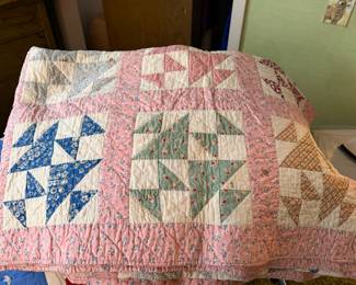 Vintage quilt is made in the traditional Broken Dishes pattern