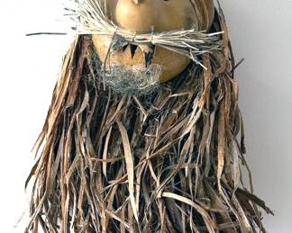 Folk art mask made of gourd, natural fibers