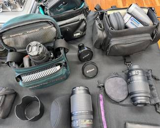 Nikon D5500 DSLR with 18-55mm lens and Tamrac bag
Nikon lenses: 70-300mm + 55-300mm
Nikon Coolpix 9900
Canon EOS100
Canon ES800 8 mm video camera with bag
Vintage Sony Sports Walkman + Weatherman