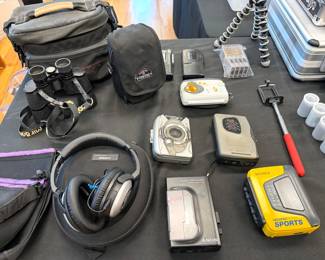 Nikon D5500 DSLR with 18-55mm lens and Tamrac bag
Nikon lenses: 70-300mm + 55-300mm
Nikon Coolpix 9900
Canon EOS100
Canon ES800 8 mm video camera with bag
Vintage Sony Sports Walkman + Weatherman