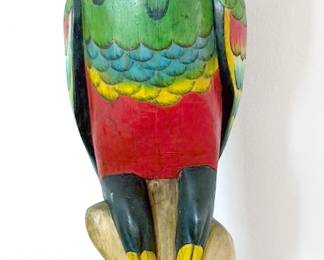 Carved wooden parrot on stand