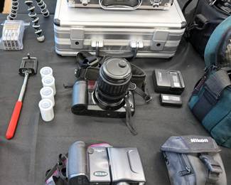 Nikon D5500 DSLR with 18-55mm lens and Tamrac bag
Nikon lenses: 70-300mm + 55-300mm
Nikon Coolpix 9900
Canon EOS100
Canon ES800 8 mm video camera with bag
Vintage Sony Sports Walkman + Weatherman